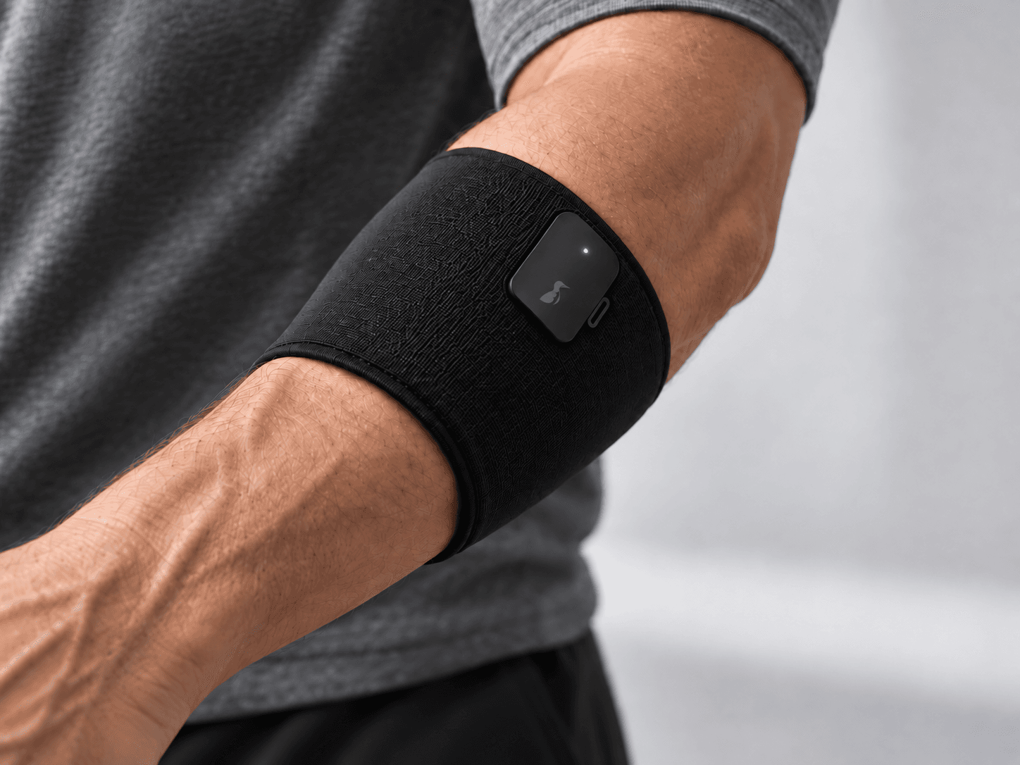 Close-up concept render of a person wearing the black Murre tactile band